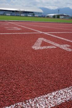 Close Up Perspective of Synthetic Red Running Track Detail Texture photo