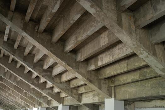 Raw Concrete Ceiling Architecture with Industrial Beam Support Structure photo