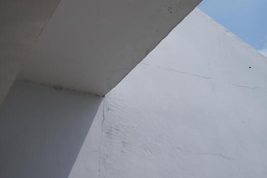 Minimalist Concrete Structure with Geometric Shapes and Light and Shadow Play photo