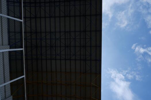Modern Industrial Metal Structure Frame And Roof with Sky View from Below photo