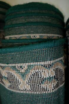 Detailed Textile Rolled Carpet with Green Accent Color Texture Material photo