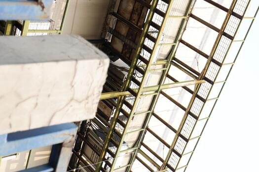 Minimalist Industrial Structure Frame with Concrete Block and Metal Grids Outdoors photo