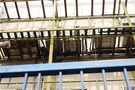 Industrial Framework Distressed Metal Building Support Structure with Exposed Wiring photo