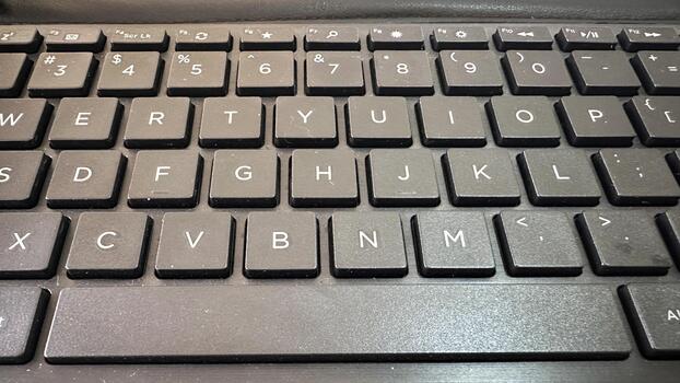 Close-up of Black Computer Keyboard with Functional Keys and Numeric Row photo