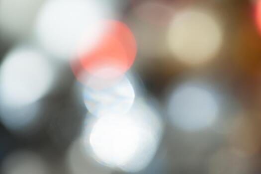 Bright bokeh lights create a soft backdrop in a blurred city setting during evening hours photo