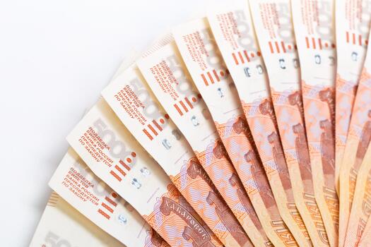 Currency notes arranged in a circular pattern showing details and design elements photo