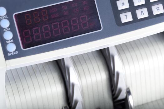 Digital display and control panel of a modern exercise machine during a gym workout session photo
