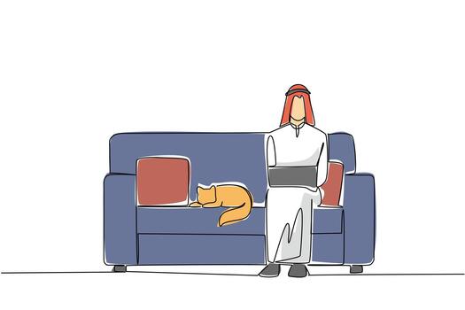 Continuous one line drawing arab man sits on sofa typing laptop on lap and cat lying down. Do not rush to complete deadlines. National Work From Home Day. Single line draw design illustration vector
