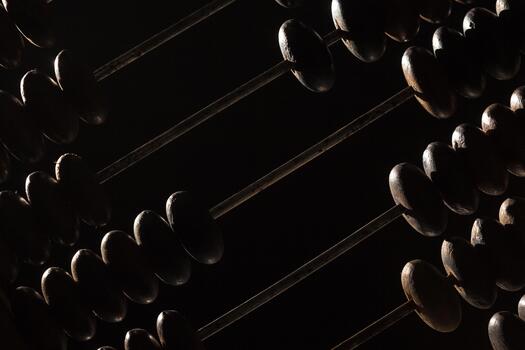 Abstract view of an abacus with dark tones and highlights enhancing its structure photo