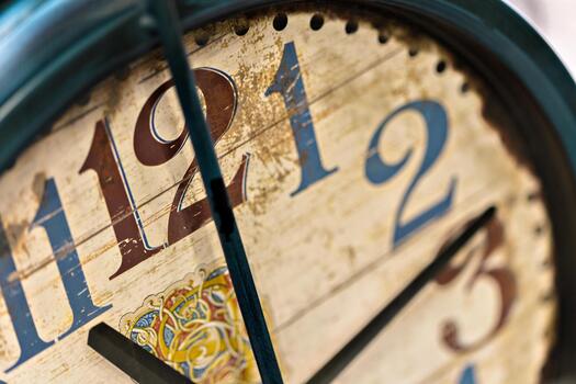Clock face showing numbers and intricate design in close-up view photo