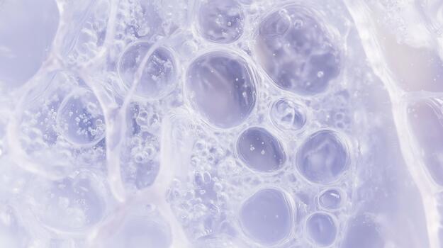 Close-up view of translucent bubbles in a light purple gel, showcasing intricate textures and reflections, creating a soothing and ethereal atmosphere in abstract composition photo