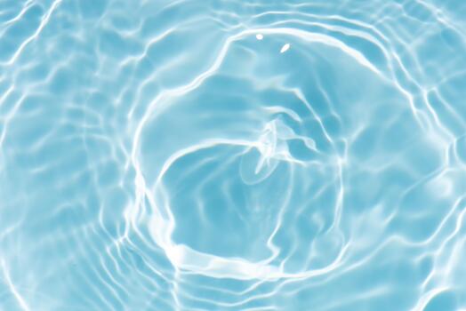 Blue water with ripples on the surface. Defocus blurred transparent blue colored clear calm water surface texture with splashes and bubbles. Water waves with shining pattern texture background.23 photo