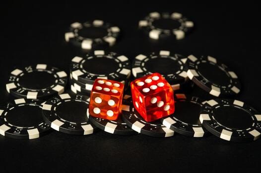 Dice and chips from winnings on the craps black table in the club. Fortune in the game depends on a successful combination in the game of dice photo