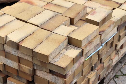 Stacked bricks on pallet representing construction and building material photo