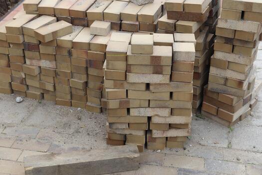 Stacking bricks for building new construction structure photo