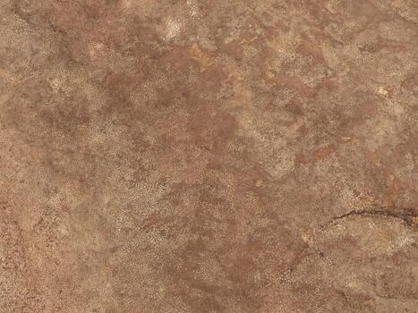 Rough brown stone surface in close-up for organic background photo
