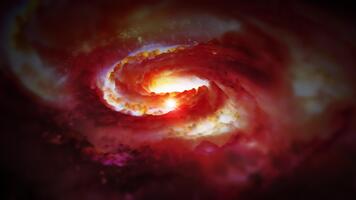 en vibrerande röd spiral galax roterar i Plats, spelar med plasma, energi, och ljus. du kan använda sig av detta animering i din astro och kosmisk projekt eller som en bakgrund. video