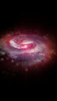 A violet-hued spiral galaxy rotates in space, playing with plasma energy and light. You can use this animation in your astrological and cosmic projects or as a background. video
