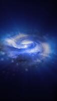 un' vivace blu spirale galassia ruota nel spazio, giocando con plasma, energia, e luce. voi può uso Questo animazione nel il tuo astrologico e cosmico progetti o come un' sfondo. video