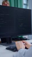Person programming on a computer video