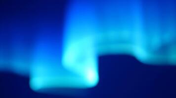 Mesmerizing blue aurora dancing across the night sky, perfect for a tranquil background or atmospheric visual effect, creating a sense of wonder video