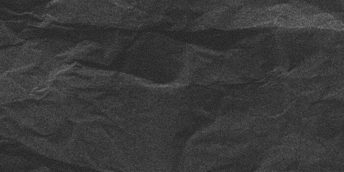 Distress overlay texture, dusty and gritty marks. Black crumpled paper surface with rough folds and subtle halftone noise, grunge backdrop. vector