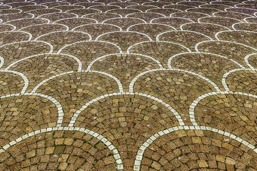 A brick walkway with a pattern of circles photo