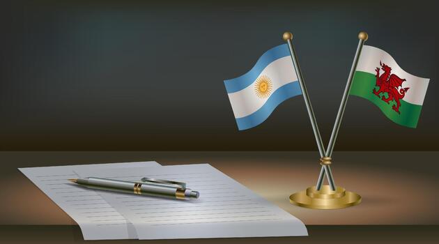 Argentina and Wales flags on table in office. International relations on a dark gradient color background. vector