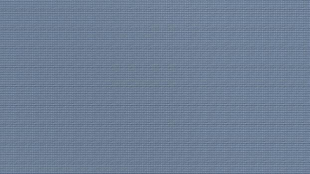 Close-up view of a pristine, textured blue fabric surface, showcasing a subtle woven pattern perfect for backgrounds and textile designs, evoking a sense of calm and modern simplicity photo