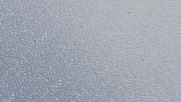 sutil ligero gris azulado resumen antecedentes textura presentando un uniforme, finamente granulado patrón, ideal para moderno diseño aplicaciones y limpiar gráfico elementos foto