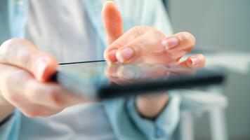 Woman chatting online on smartphone close up, typing text message, touching touchscreen keyboard, using messenger application. video