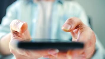 Woman scrolling through social media feeds on smartphone close up, touching touchscreen, using messenger application. video