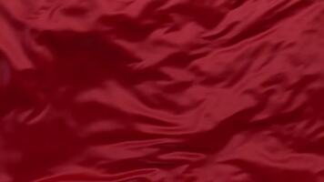 abstrato fluindo profundo vermelho tecido textura fundo com suave luz e sombras. video