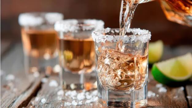 Tequila shots are poured and shared, igniting fun and unforgettable memories party pulse. photo