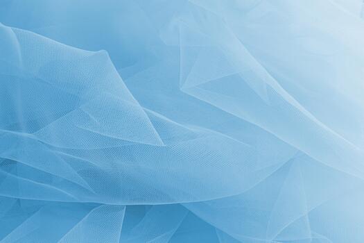 Abstract background of blue airy fabric. light folds of the transparent mesh of the veil of heavenly color. It is relevant for the layout of festive. photo