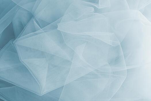 Abstract background of an airy veil of blue. soft folds of silk transparent fabric. Mesh fabric texture. layout for design. A copy of the space. photo