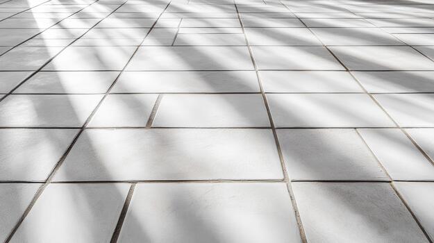 Soft diagonal palm shadow across white tiled floor creating calm minimal pattern photo