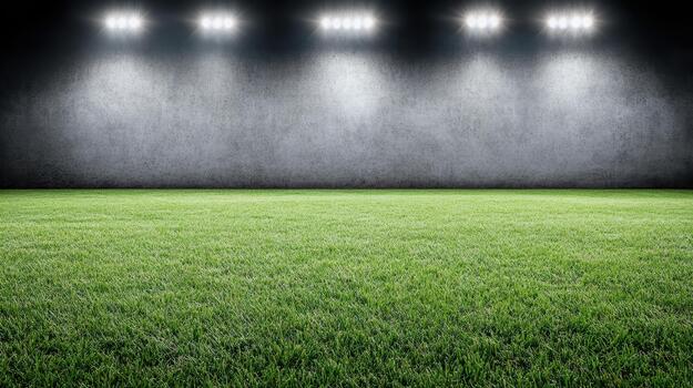 Stadium floodlight shining on green grass field with concrete backdrop, dramatic lighting photo