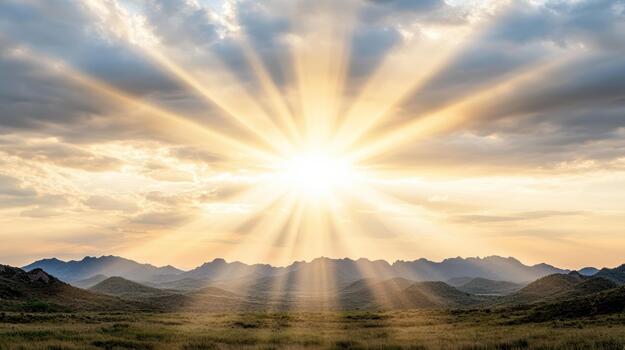 Sunbeams shining over a mountain range photo