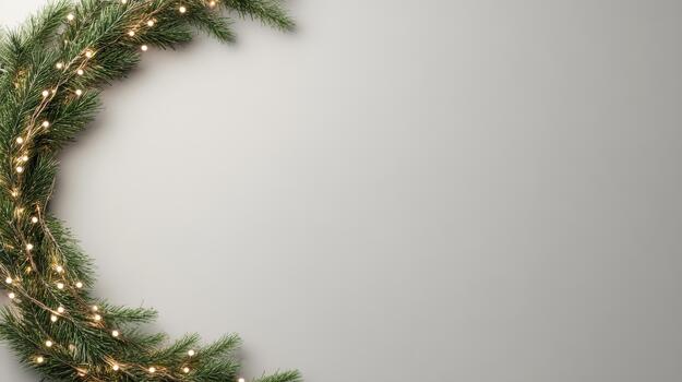 Pine greenery wreath glowing with warm fairy lights on neutral backdrop photo