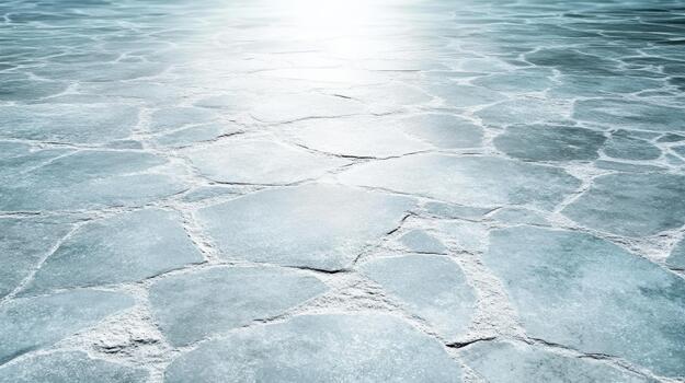 Shimmering icy salt flat with hexagonal cracked surface and soft sunlight glow photo