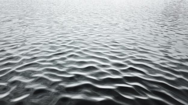 Rippling water surface with soft reflections and moody atmosphere photo