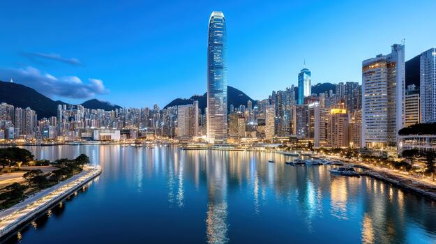 Serene illuminated harbor skyline reflecting in water at dusk photo