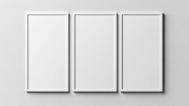 Three blank white frames on a wall photo