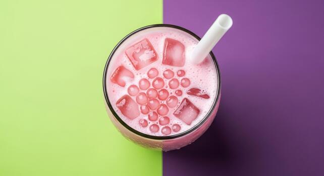 Overhead View of Pink Fruit Drink with Tapioca Pearls and Ice Cubes on Split Background photo