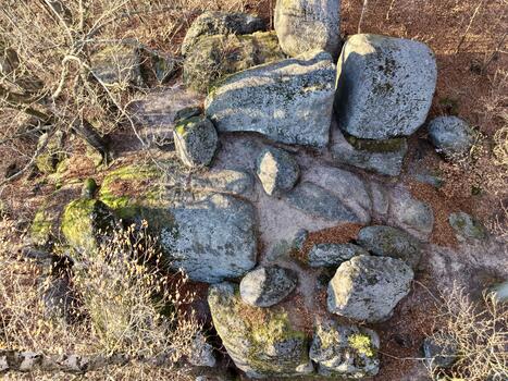 Drone Captures Rugged Stone Terrain, Clustering Of Rocks Showcases Steep Topography And Contrast photo