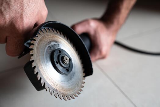 Macro close-up of a circular saw - cutting disc attached to an angle grinder. Ideal for manufacturing, tool parts listings and mechanical tutorials. photo