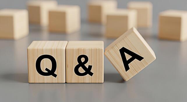 Wooden blocks displaying Q A on a gray surface representing a question and answer session knowledge sharing and problemsolving in a simple and engaging manner ideal for educational or business context photo