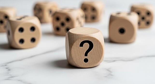Wooden dice displaying a question mark on a marble surface symbolizing uncertainty and decisionmaking creating a mood of contemplation and the need for strategic planning in business and life photo