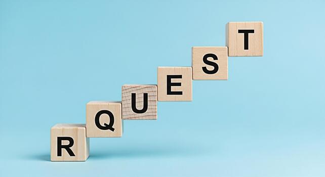 Wooden blocks spelling REQUEST stacked in ascending order on a light blue background symbolizing a call to action a query or a formal application in a business or customer service context photo